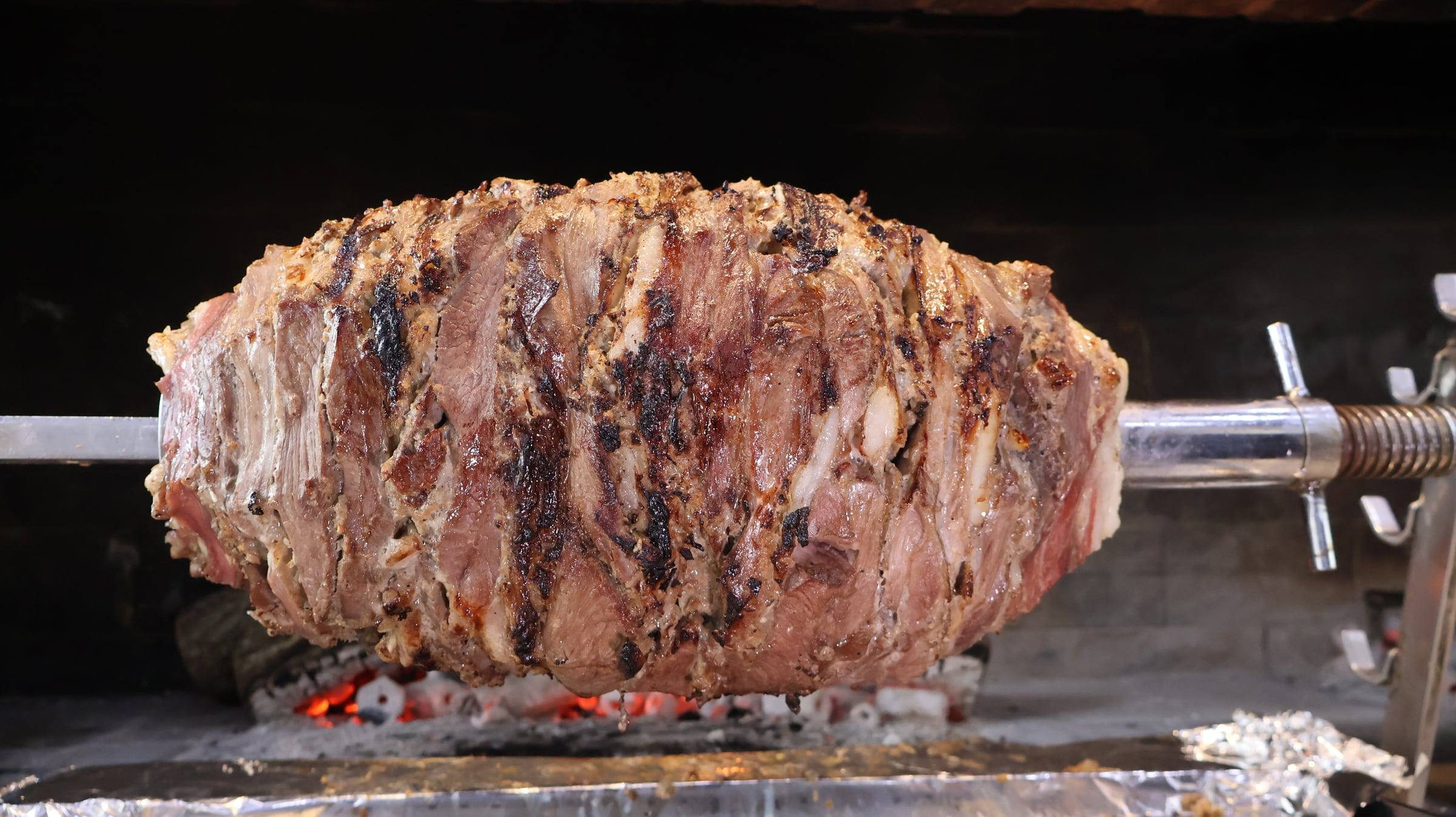 Close-up of the layered lamb on the spit